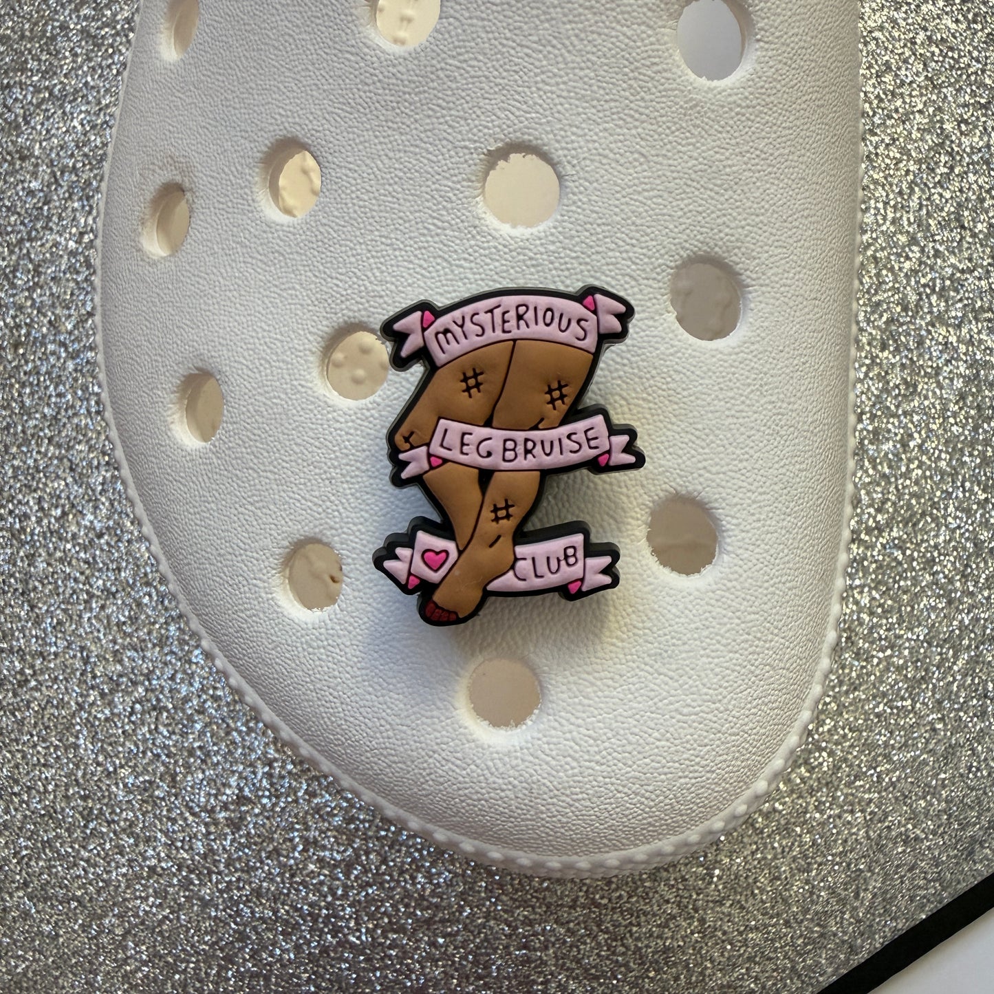 Mystery leg bruise club shoe charm